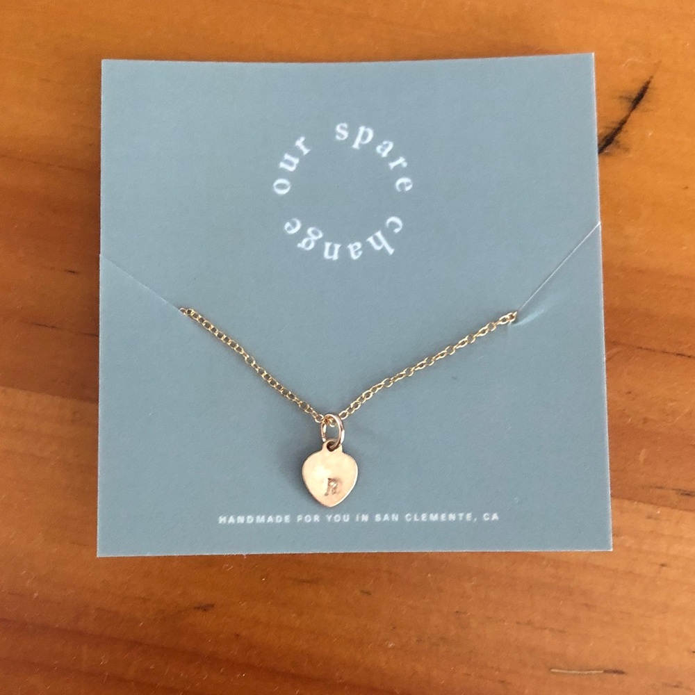 Our spare change letter “r” gold heart necklace